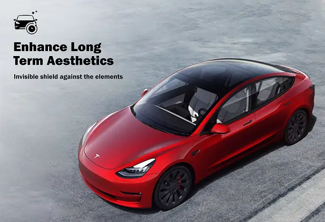 Overhead view of a glossy red Tesla Model 3 with tinted windows, parked on a concrete surface, promoting long-term aesthetics protection against environmental damage.