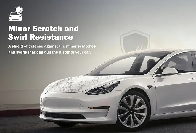 White Tesla Model 3 with a clean, scratch-free finish parked on a quiet street, illustrating the benefits of paint protection film for minor scratch and swirl resistance.