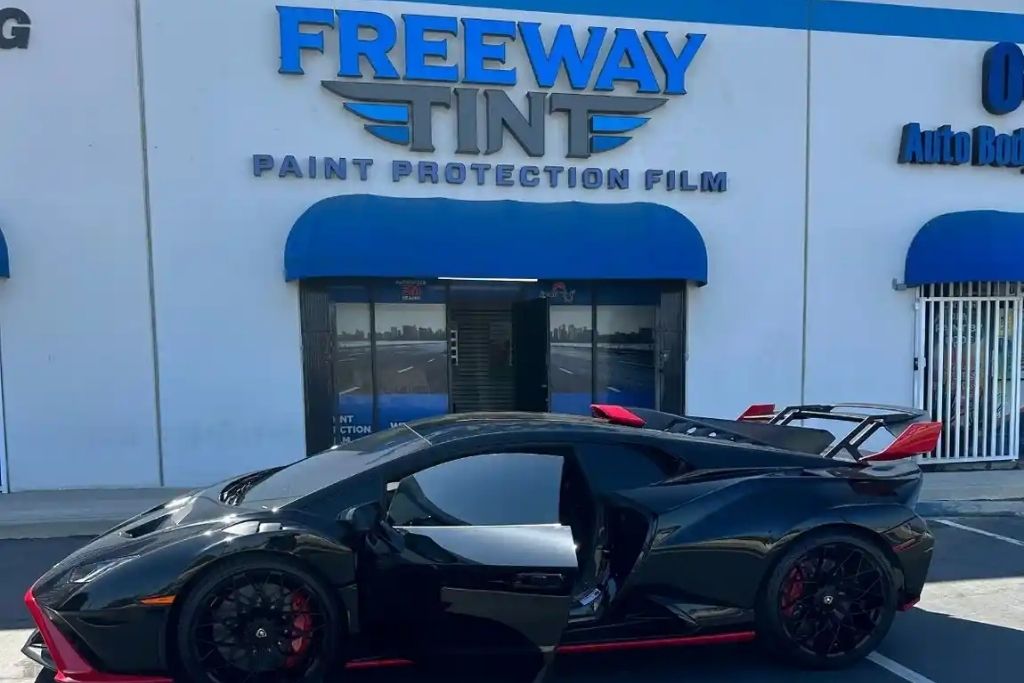 Black Lamborghini parked outside Freeway Tint in Riverside CA after professional window tint and paint protection film service.